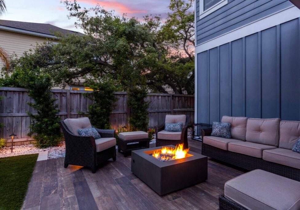 Beautiful backyard firepit at dusk with comfortable chairs